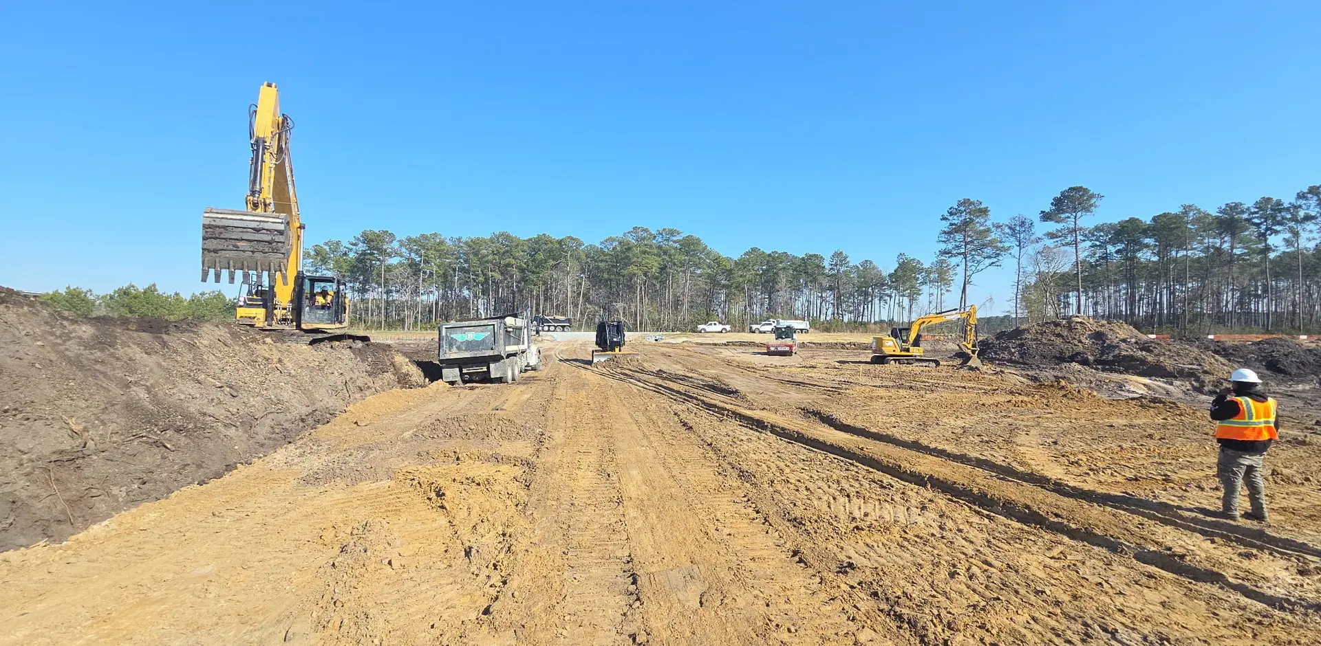 Laser Construction site work — clearing, grubbing, grading, and hauling services